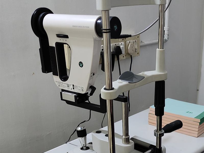 Slit-lamp and retinal camera on a table in an Indian eye clinic