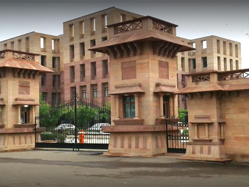 Sandstone entrance gate of AIIMS Jodhpur with hospital blocks behind