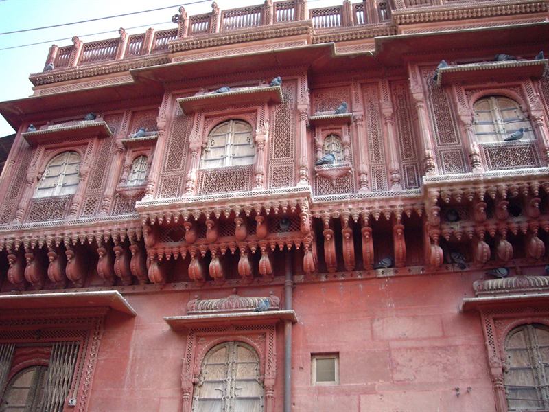 Carved pink sandstone haveli façade in Phalodi, Jodhpur district